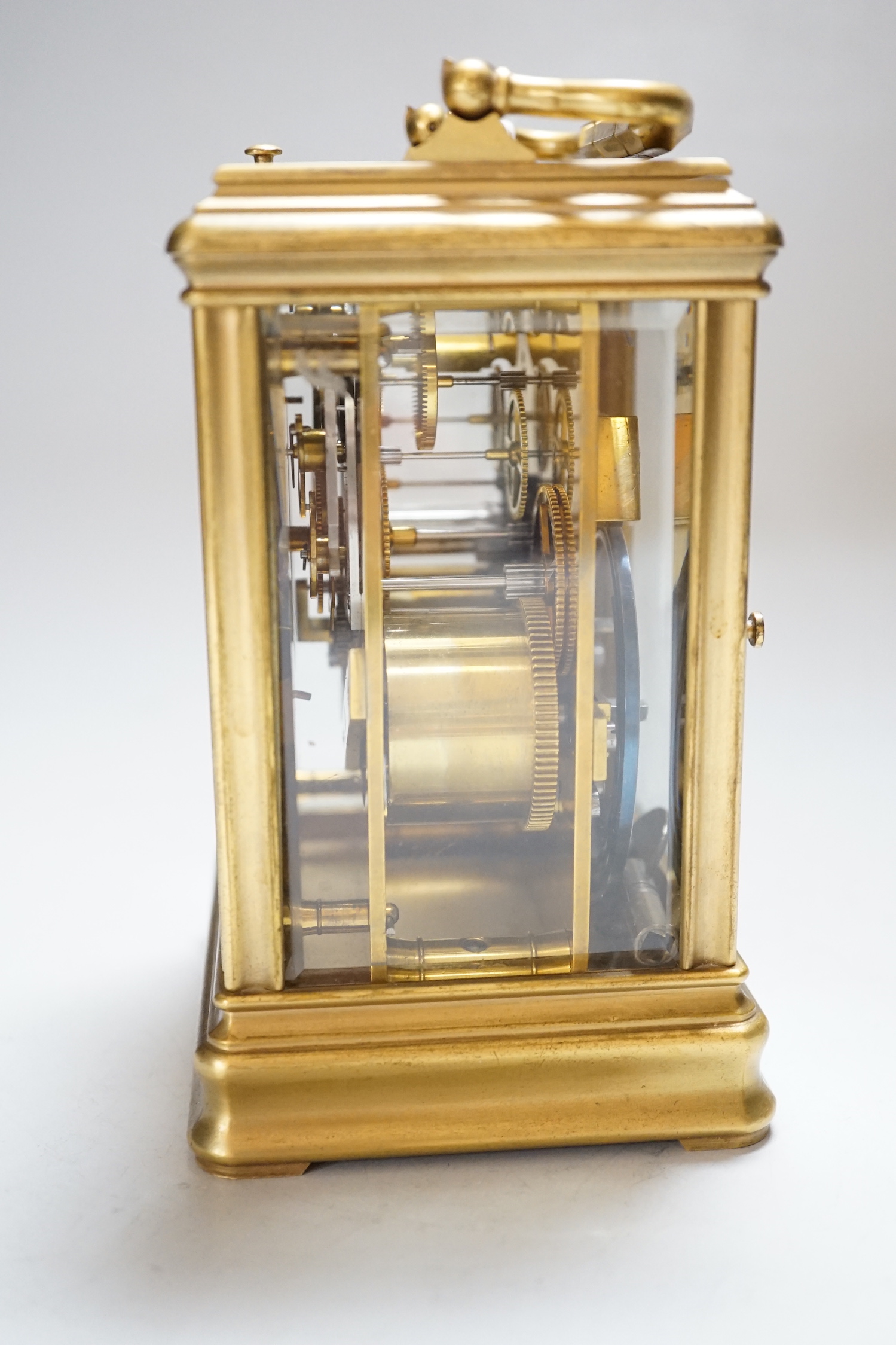 A late 19th century French ormolu, hour repeating carriage clock, with gorge case and enamelled Roman dial, 9.5cm wide, 8.5cm deep, 15cm high